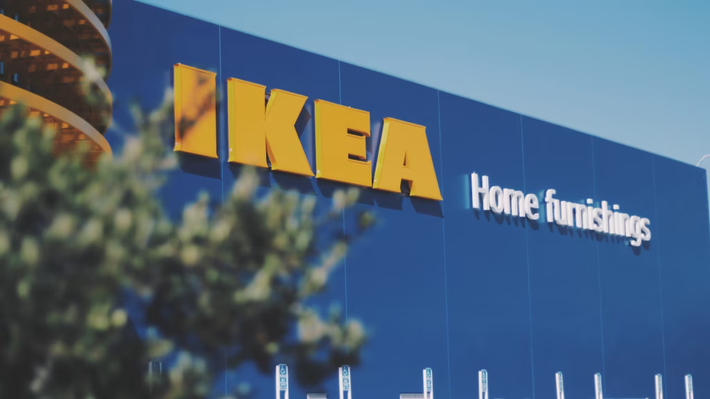 Exterior shot of an IKEA store with the iconic blue facade and yellow logo, showcasing the venue for the upcoming music festival. - midnightrebels.com