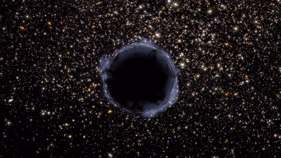 A digital illustration depicts a black hole, a dark circular void surrounded by a faint blue accretion disk, set against a dense backdrop of twinkling stars of various sizes and colors. - midnightrebels.com