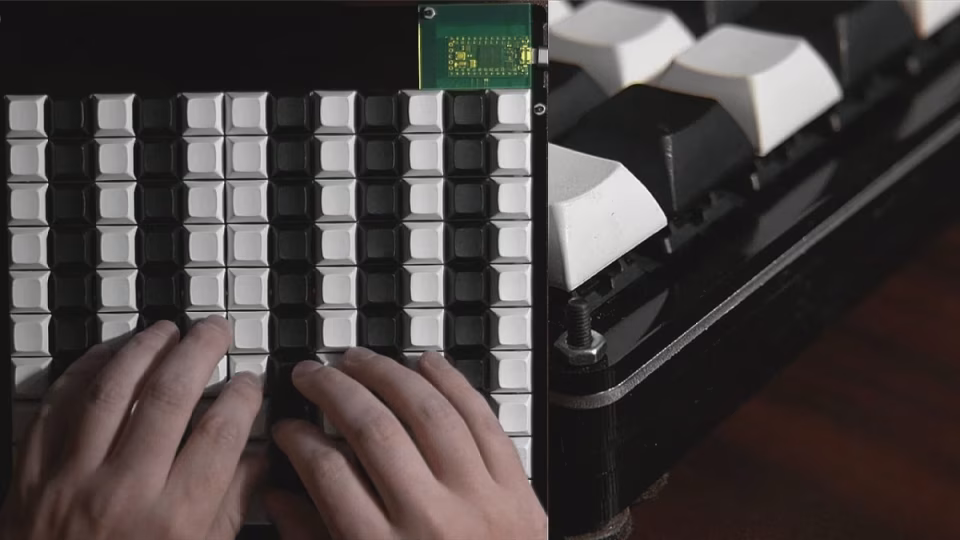 A user plays a MIDI controller made from an upcycled PC keyboard, featuring black and white keycaps and visible internal circuitry. - midnightrebels.com
