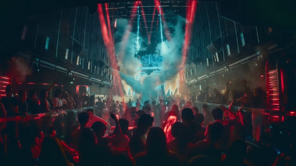 Crowd enjoying the SSHHH event at BSK's new Secret Room on April 26th, bathed in atmospheric lighting and surrounded by smoke effects. - midnightrebels.com