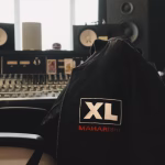 XL Maharishi jacket draped over a chair in a recording studio.