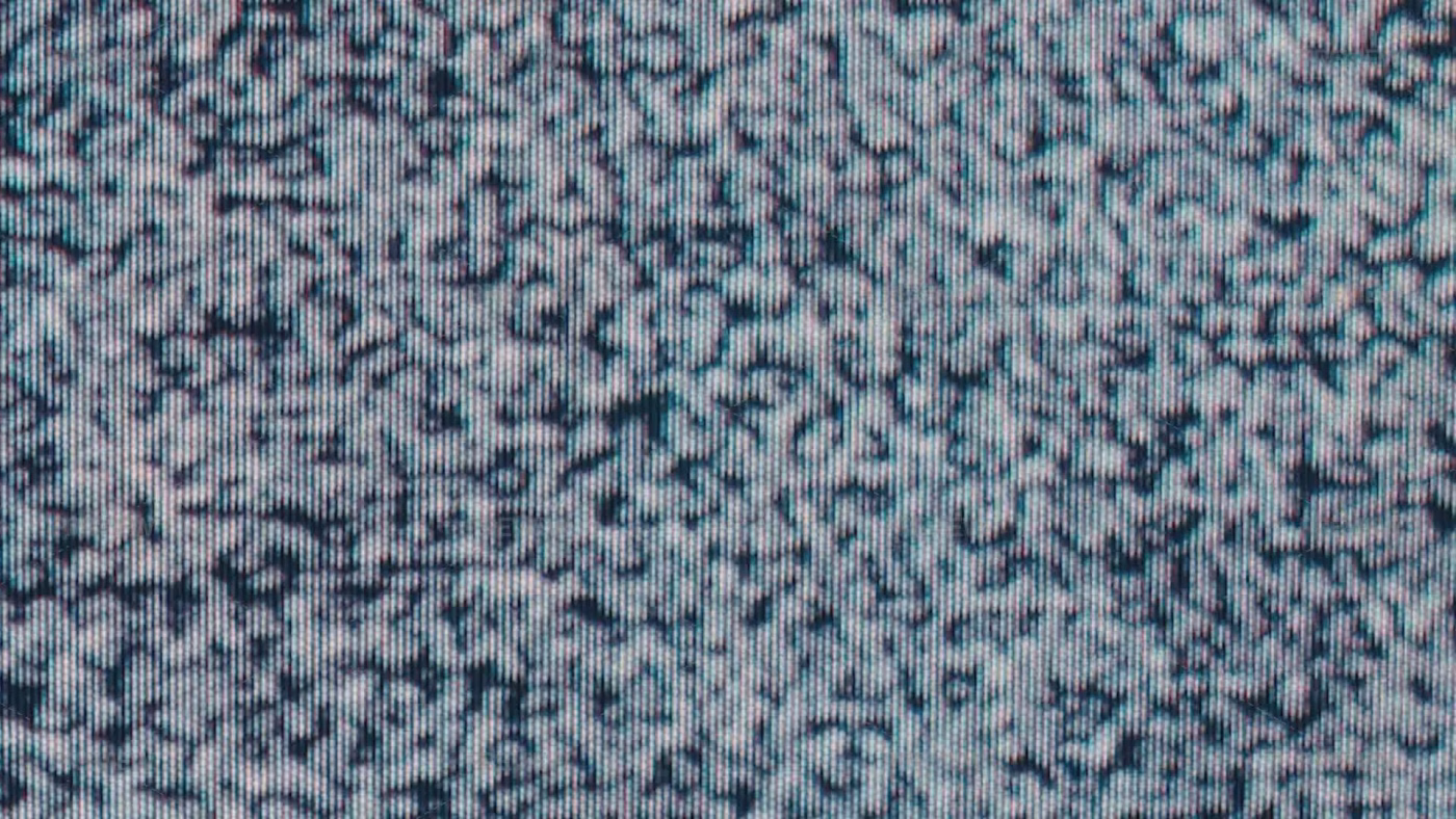 * **Television static close-up, gray, white, and black noise pattern.** * **TV screen static pattern: pixelated noise, gray, black, and white.**