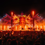 Large crowd at EDC Thailand with stage, lights, and fire.